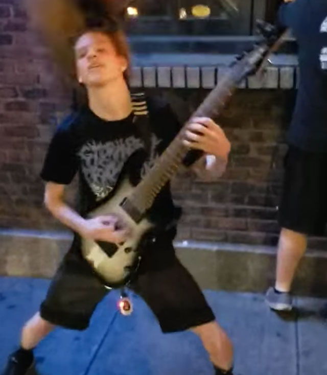 Guitarist too young to shred in venue, performs on the street