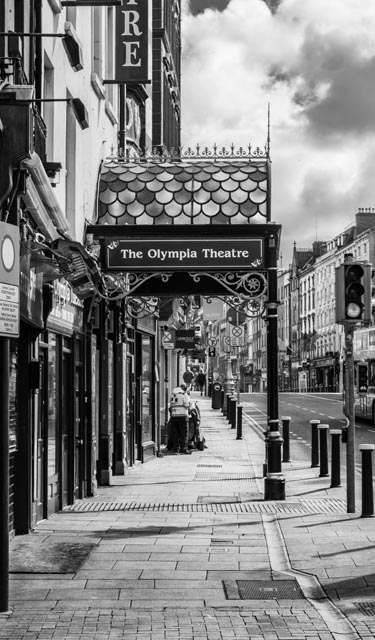 Grayscale shot of the sign of the Olympia Theatre on a street in | Metal Insider